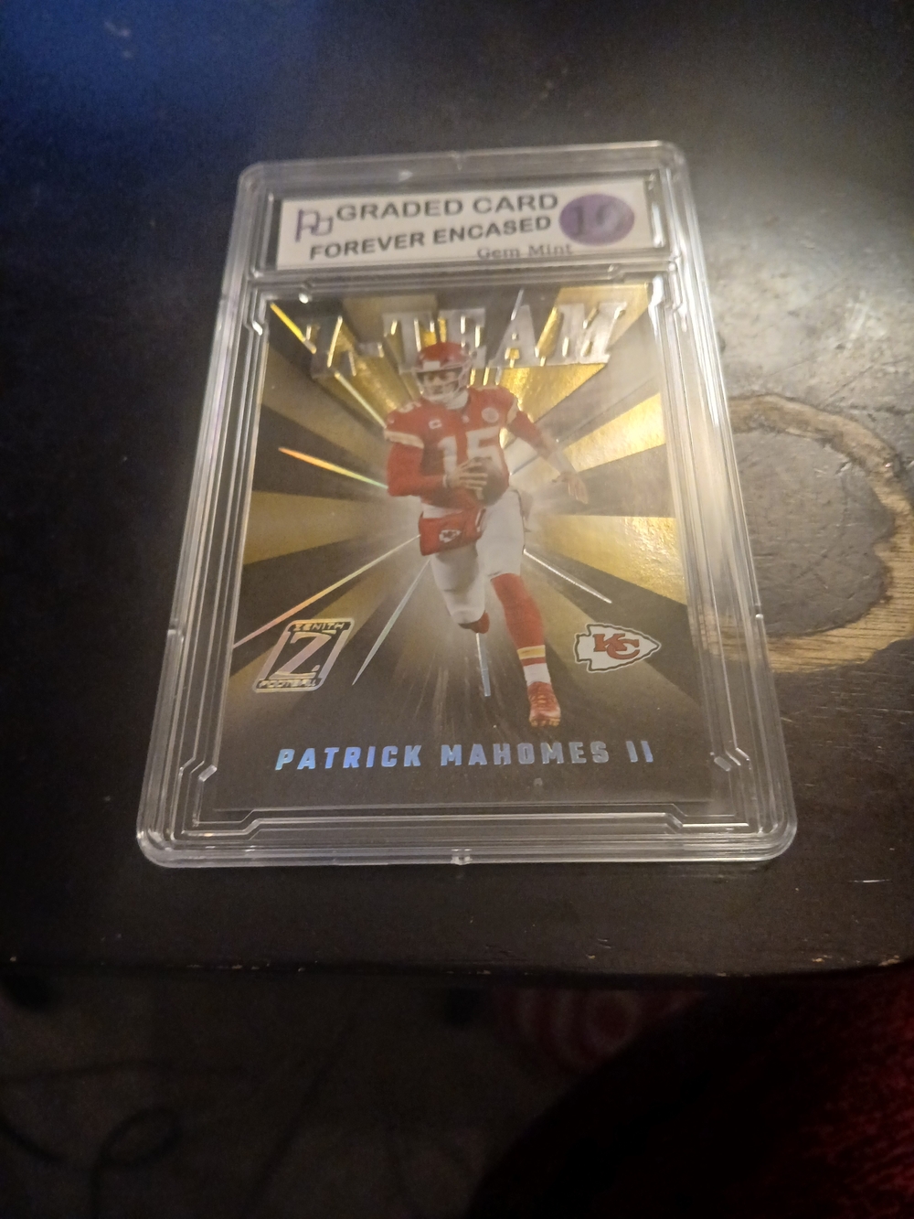 Premium Graded Football Trading Card in Red & Gold Display Case